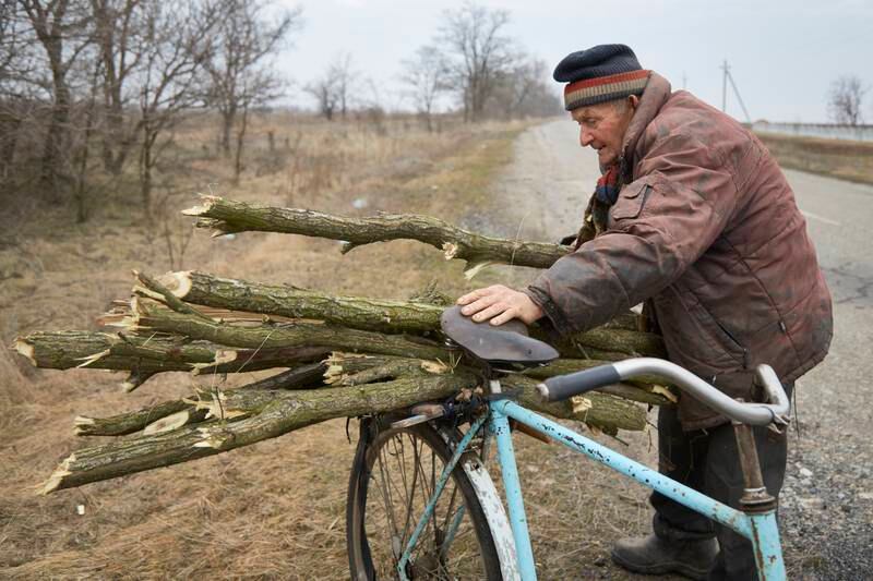 Pensioner Viktor collects firewood in Novokostyantynivka. European natural gas prices surged as the US rejected Russia’s claims that it was pulling back troops. Getty Images