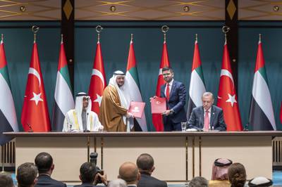 Sheikh Mohamed and Mr Erdogan at the ceremony, where an agreement was signed between Mohamed Al Suwaidi, chief executive of the Abu Dhabi Developmental Holding Company and Burak Daglioglu, president of the Turkey Investment Office. Abdulla Al Neyadi / Ministry of Presidential Affairs