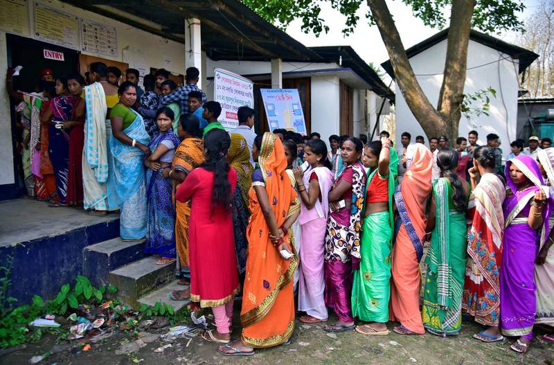 People wait in queues to cast their votes outside a polling station during the second phase of general election in Hojai district in the northeastern state of Assam, India, April 18, 2019. REUTERS/Anuwar Hazarika