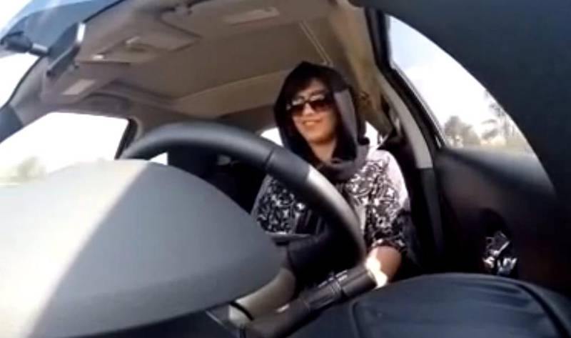 A still from a video released by Loujain Al Hathloul shows her driving towards the UAE-Saudi Arabia border before her arrest on December 1, 2014, in Saudi Arabia. Loujain Al Hathloul / AP Photo