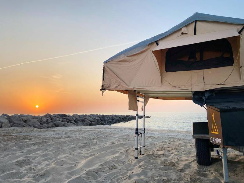 You can choose to camp on the beach or in the desert. Photo: Campr