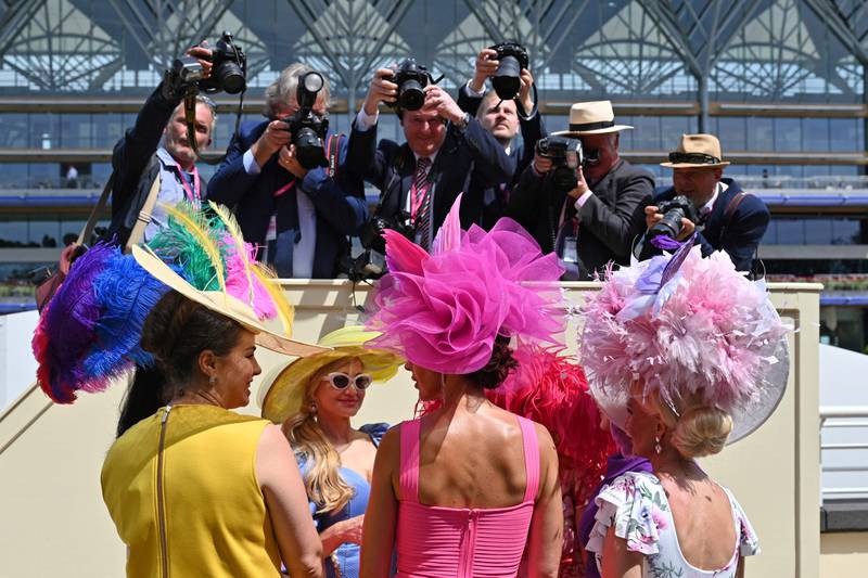 Race-goers chat during the third day, known as the Lady's day, of the Royal Ascot horseracing meet, in Ascot, west of London. AFP