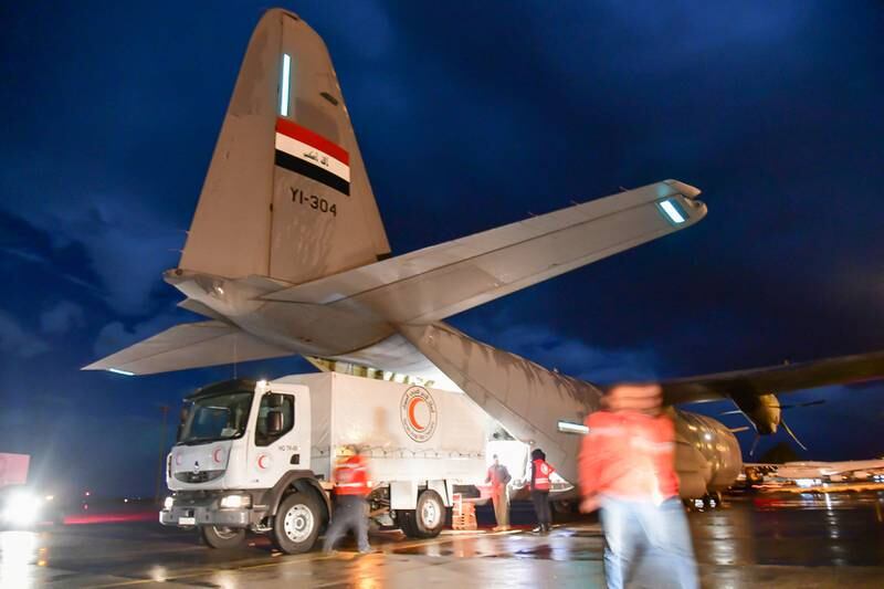 An Iraqi plane offloads aid at Damascus airport in Syria. Reuters