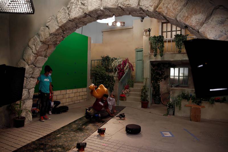 The staff of the children's programme 'Ahlan Simsim' film a scene on the set of the show in a studio in Amman, Jordan. Reuters