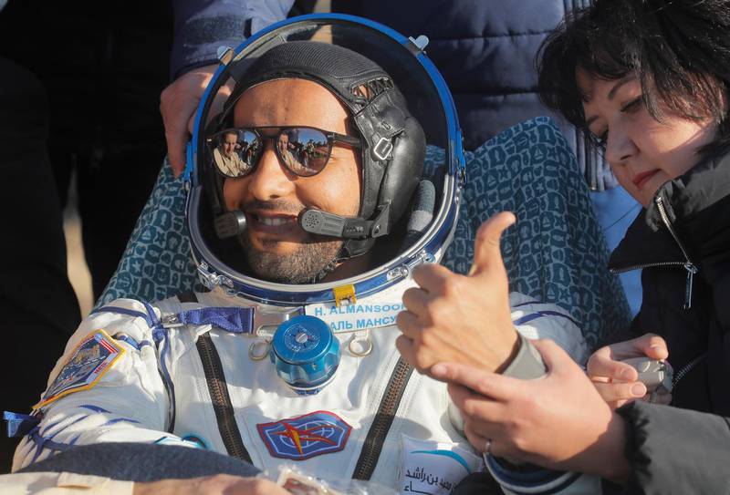 epa07891614 United Arab Emirates (UAE) spaceflight participant Hazza Ali Almansoori gestures shortly after the landing of the Russian Soyuz MS-12 space capsule about 150 km ( 90 miles) south-east of the Kazakh town of Zhezkazgan in Kazakhstan, 03 October 2019. A Soyuz space capsule with U.S. astronaut Nick Hague, Russian cosmonaut Alexey Ovchinin and United Arab Emirates astronaut Hazzaa Ali Almansoori, returning from a mission to the International Space Station landed safely in the steppes of Kazakhstan.  EPA/DMITRI LOVETSKY/POOL / POOL