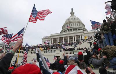A mob of supporters of U.S. President Donald Trump storm the U.S. Capitol Building in Washington, U.S., January 6, 2021. Picture taken January 6, 2021. REUTERS/Leah Millis