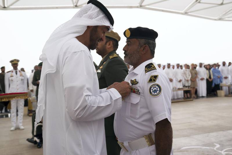 ABU DHABI, UNITED ARAB EMIRATES - April 23, 2018: HH Sheikh Mohamed bin Zayed Al Nahyan Crown Prince of Abu Dhabi Deputy Supreme Commander of the UAE Armed Forces (L), awards a member of the UAE Armed Forces with a Medal of Bravery for his service in Yemen, during a Sea Palace barza.

( Mohamed Al Hammadi / Crown Prince Court - Abu Dhabi )
---
