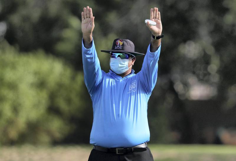 Dubai, United Arab Emirates - Reporter: N/A. Sport. Cricket. The umpire signals a six during the match between the ECB Blues and Dubai in the Emirates D10. Friday, July 24th, 2020. Dubai. Chris Whiteoak / The National