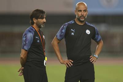 Pep Guardiola, manager of Manchester City, and coach Lorenzo Buenaventura.