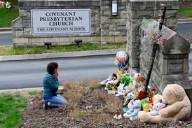 A memorial of flowers and toys at The Covenant School's entrance in Nashville on Tuesday. AP