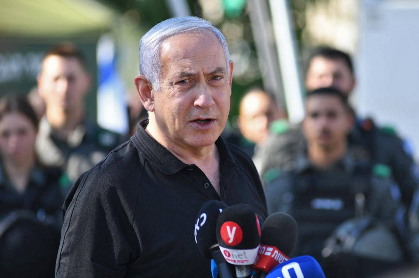 Israeli Prime Minister Benjamin Netanyahu speaks during a meeting with Israeli border police in the central city of Lod, near Tel Aviv, on May 13, 2021, a day after Israeli far-right groups clashed with security forces and Arab Israelis. Late on May 12, Israeli far-right groups took to the streets across the country, clashing with security forces and Arab Israelis. Police said they had responded to violence in multiple towns, including Lod, Acre and Haifa. A state of emergency has been declared with entry restrictions and a curfew in the mixed Jewish-Arab city of Lod, where an Arab resident was shot dead and a synagogue torched. / AFP / POOL / Yuval CHEN
