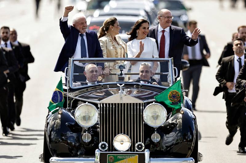 Brazil's president-elect Luiz Inacio Lula da Silva, vice president-elect Geraldo Alckmin and their spouses wave to supporters from a 1952 Rolls-Royce Silver Wraith on their way to the swearing-in ceremony, in Brasilia. All photos: Reuters