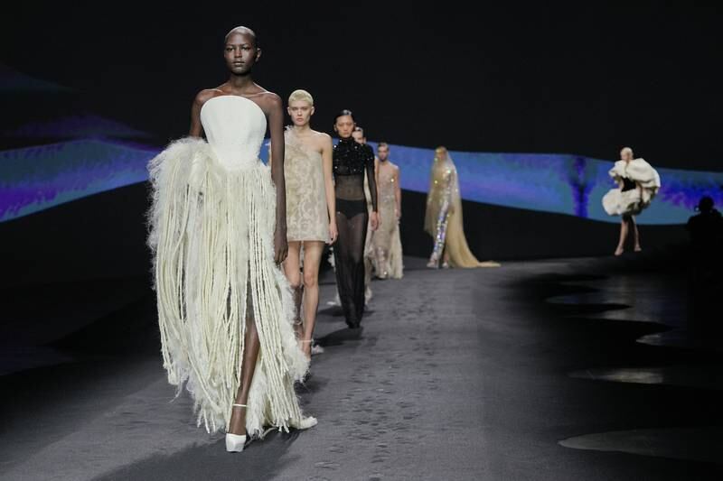 Models walk the runway during the Ashi Studio haute couture show in Paris. Getty Images