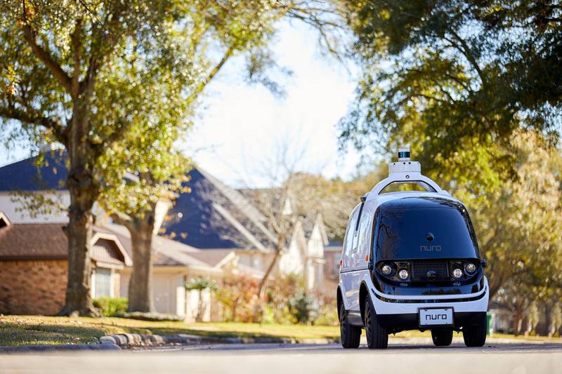 This undated image provided by Nuro in February 2020 shows their self-driving vehicle "R2" on a neighborhood street. On Thursday, Feb. 6, 2020, the U.S. National Highway Traffic Safety Administration granted temporary approval for Silicon Valley robotics company Nuro to the a low-speed autonomous delivery vehicle, without side and rear-view mirrors and other safety provisions required of vehicles driven by humans. (Nuro via AP)