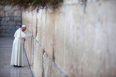 Pope Francis prays by the Western Wall in Jerusalem, Israel, May 2014. Getty Images