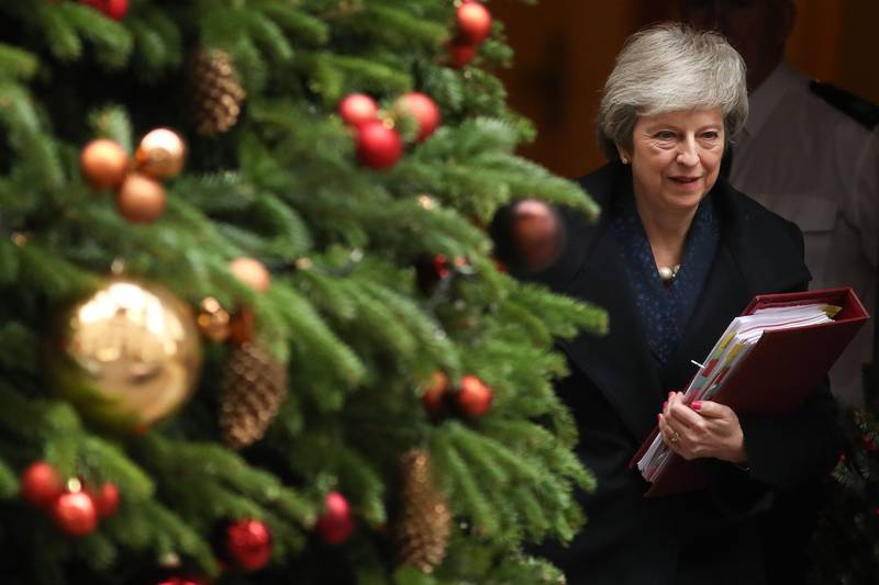 Britain's Prime Minister Theresa May leaves 10 Downing Street in central London on December 12, 2018 ahead of the weekly question and answer session, Prime Ministers Questions (PMQs), in the House of Commons.  British Prime Minister Theresa May was hit by a no-confidence motion by her own party on December 12 over the unpopular Brexit deal she struck with EU leaders last month. Facing her biggest crisis since assuming office a month after Britons voted in June 2016 to leave Europe, May vowed to fight the coup attempt inside her own Conservative Party "with everything I've got".
 / AFP / Daniel LEAL-OLIVAS
