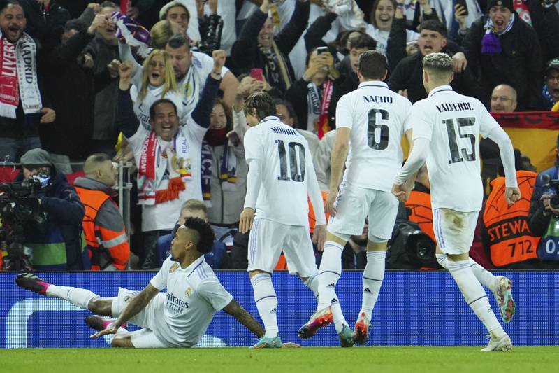 Madrid's Eder Militao, left, celebrates after scoring his side's third goal. AP