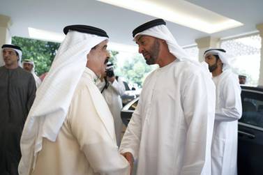 ABU DHABI, UNITED ARAB EMIRATES - November 20, 2019: HM King Hamad bin Isa Al Khalifa, King of Bahrain (L) offers condolences to HH Sheikh Mohamed bin Zayed Al Nahyan, Crown Prince of Abu Dhabi and Deputy Supreme Commander of the UAE Armed Forces (R), on the passing of the late HH Sheikh Sultan bin Zayed Al Nahyan, at Al Mushrif Palace. ( Mohamed Al Hammadi / Ministry of Presidential Affairs ) ---