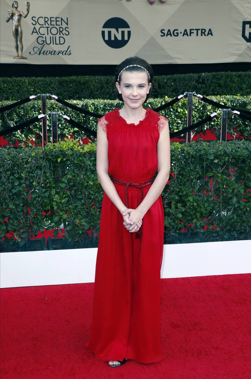Millie Bobby Brown, wearing red Giorgio Armani, arrives for the Screen Actors Guild Awards in Los Angeles on January 29, 2017.  EPA