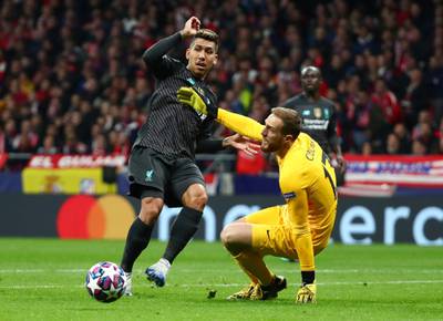 Liverpool's Roberto Firmino in action with Atletico Madrid's Jan Oblak. Reuters