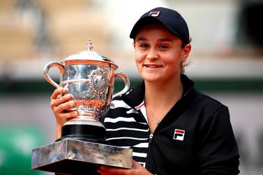 Women's French Open champion Ashleigh Barty celebrates with the French Open trophy. Getty