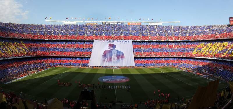 Barcelona supporters display a huge banner inside Camp Nou to thank Xavi Hernandez for his career. EPA