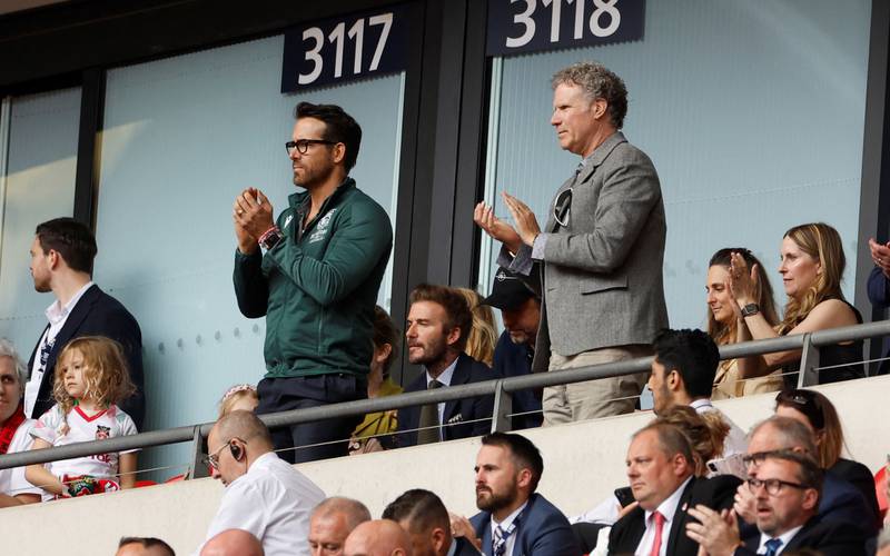 Reynolds, Beckham and Will Ferrell at a match. Reuters