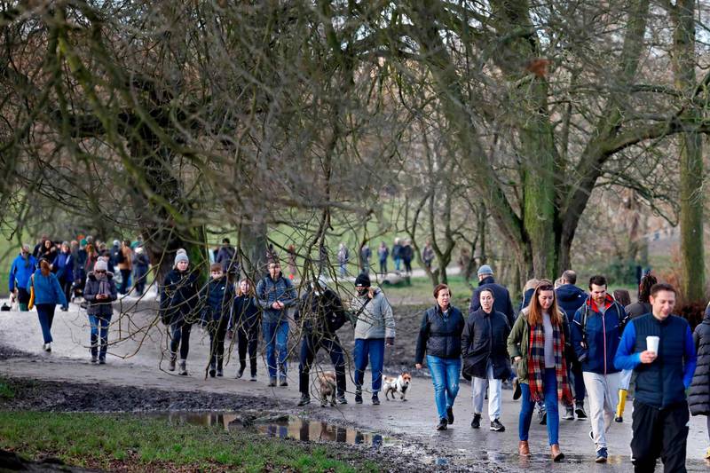 Members of the public enjoy a stroll on Hampstead Heath in London. AFP