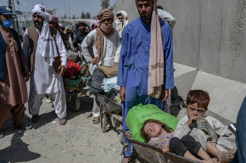 People wait to enter Pakistan at the Spin Boldak border crossing in the southern Afghan province of Kandahar. Photo: AFP