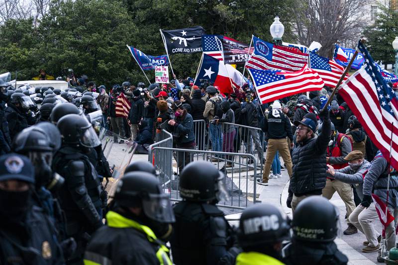 Insurrectionists loyal to former president Donald Trump confront US Capitol Police officers outside the Capitol in Washington,  January. AP