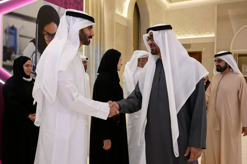 Sheikh Mohamed shakes hands with Salem Al Qassimi, Minister of Culture and Youth