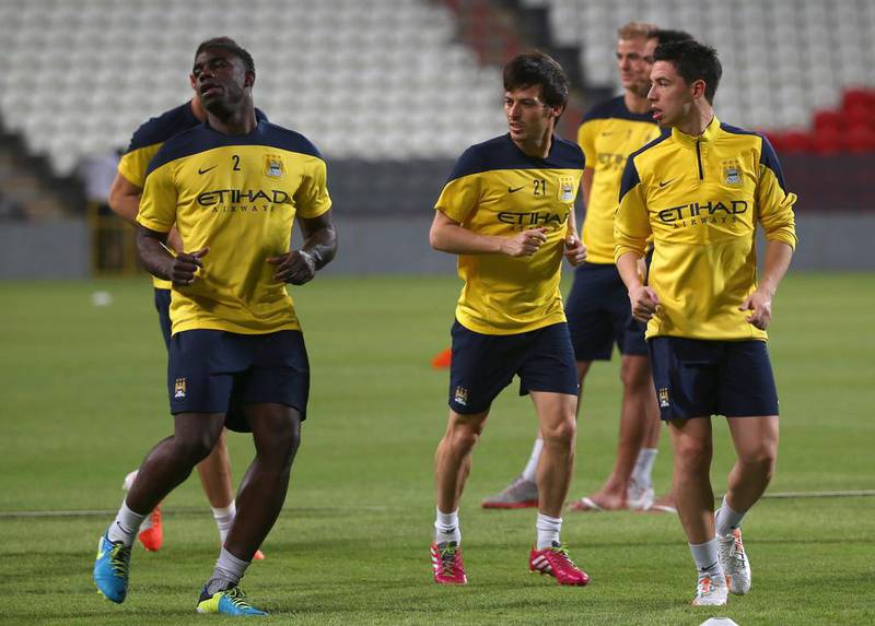 Manchester City players Micah Richards, left, David Silva, centre, and Samir Nasri, right, during a team training session in Abu Dhabi in 2014.