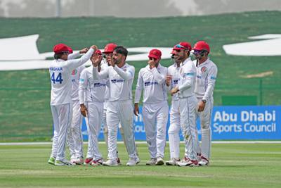 Afghanistan celebrate after Rashid Khan dismissed Zimbabwe's Tarisai Musakanda. Courtesy Abu Dhabi Cricket