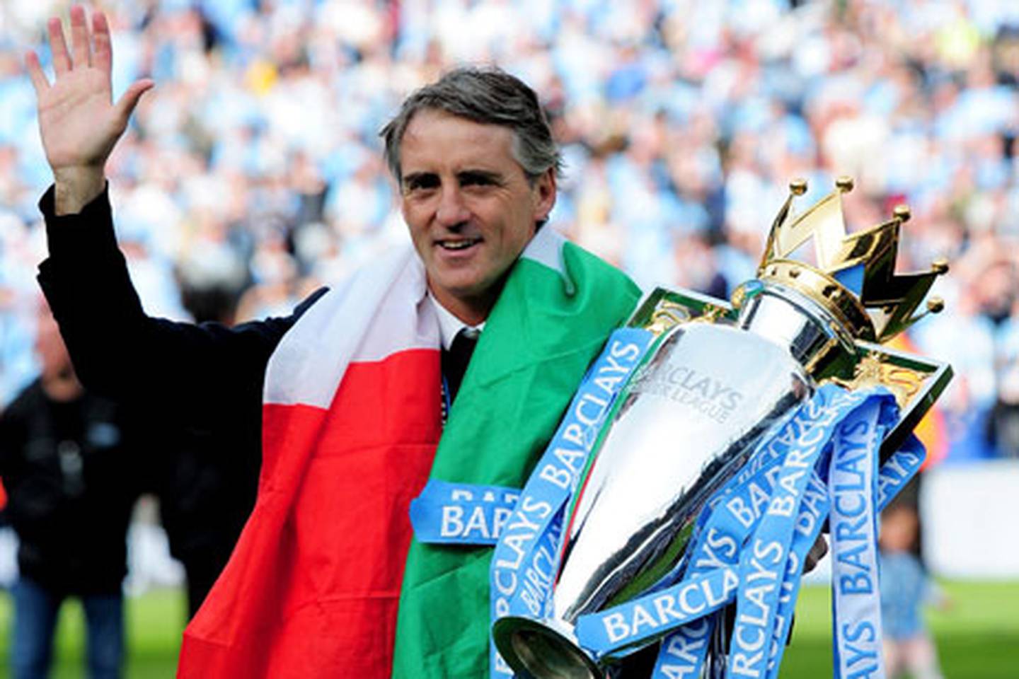 Robert Mancini with the Premier League trophy after the win against QPR