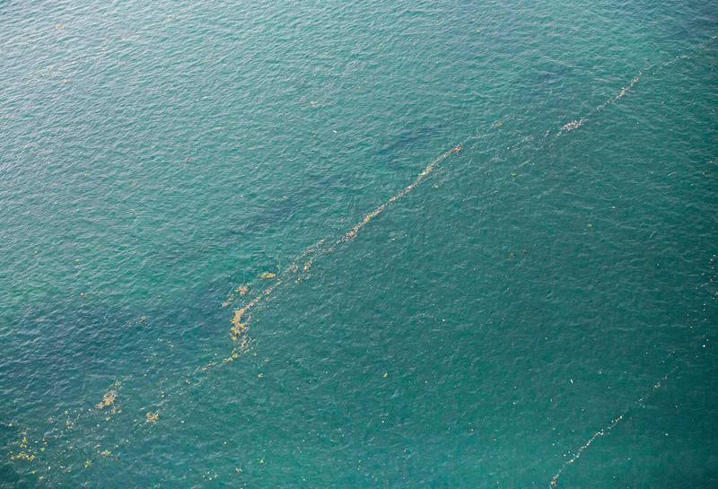 This aerial shot taken from an Indonesian Air Force plane shows oil slick and debris floating on the water near the site where Sriwijaya Air passenger jet is thought to have crashed near Jakarta, Indonesia.  AP Photo