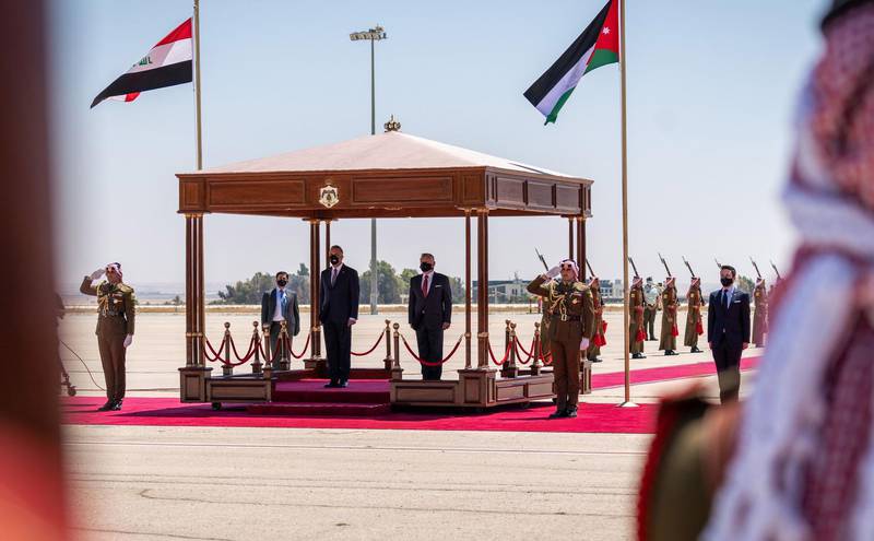 Jordan's King Abdullah II welcomes Iraqi Prime Minister Mustafa Al Kadhimi  ahead of the summit in Amman. AFP