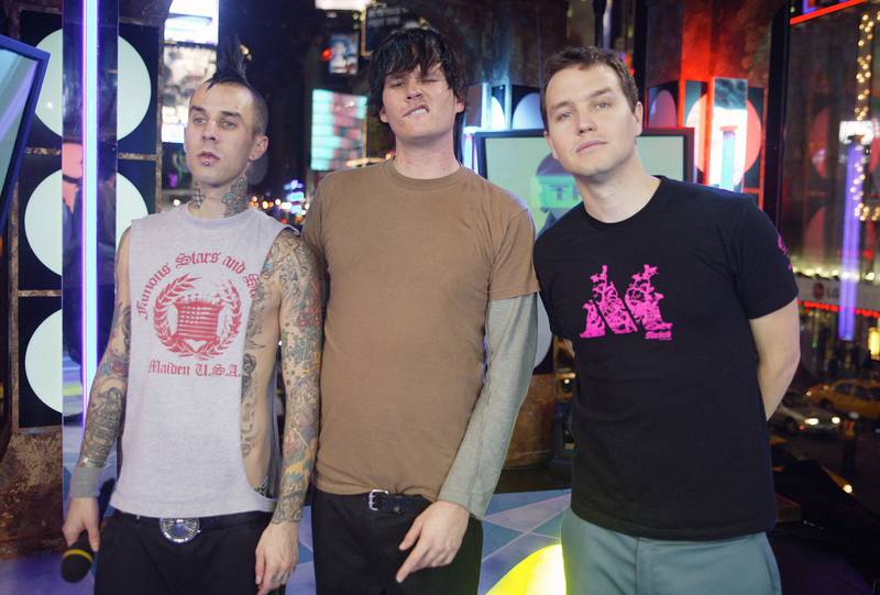 From left, Travis Barker, Tom DeLonge and Mark Hoppus on MTV's 'Total Request Live' at the MTV Times Square Studios in November 2003 in New York City. Getty