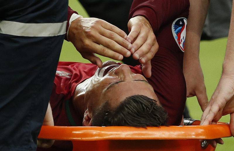 Portugal’s Cristiano Ronaldo is stretchered off injured during the Uefa Euro 2016 Final at the Stade de France, 10 July 2016. John Sibley / Reuters