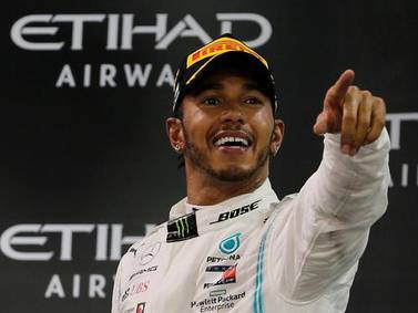 Lewis Hamilton celebrates after winning last season's Abu Dhabi GP. Reuters