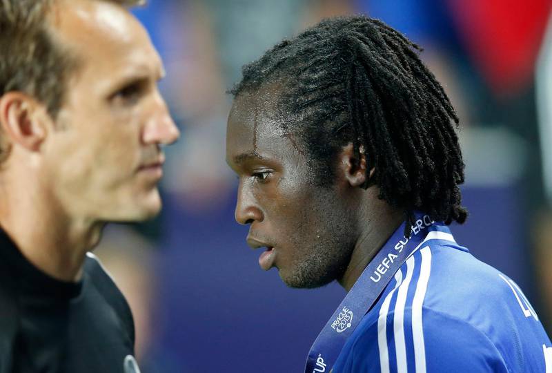 Chelsea's Romelu Lukaku, right walks past teammate Chelsea's Mark Schwarzer during he trophy ceremony for the soccer Super Cup final between Champions League winner Bayern Munich and Europa League winner Chelsea FC  at the Eden Stadium in Prague Friday, Aug. 30, 2013. Chelsea lost a penalty shoot out after extra time 4-5, with Lukaku missing his penalty for Bayern to win.(AP Photo/Michael Sohn)  *** Local Caption ***  Czech Republic Soccer Super Cup.JPEG-0b6dd.jpg
