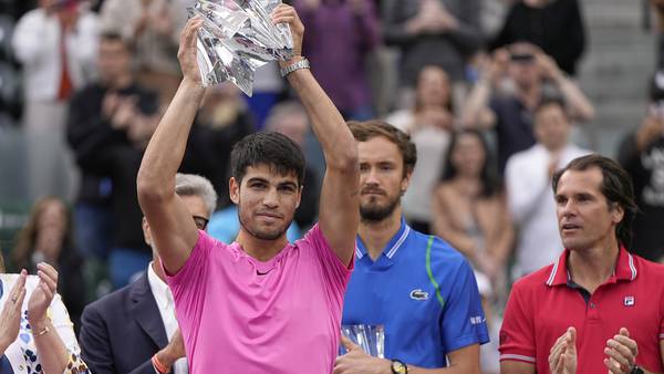 Carlos Alcaraz lifts the Indian Wells trophy after defeating Daniil Medvedev in the final. AP