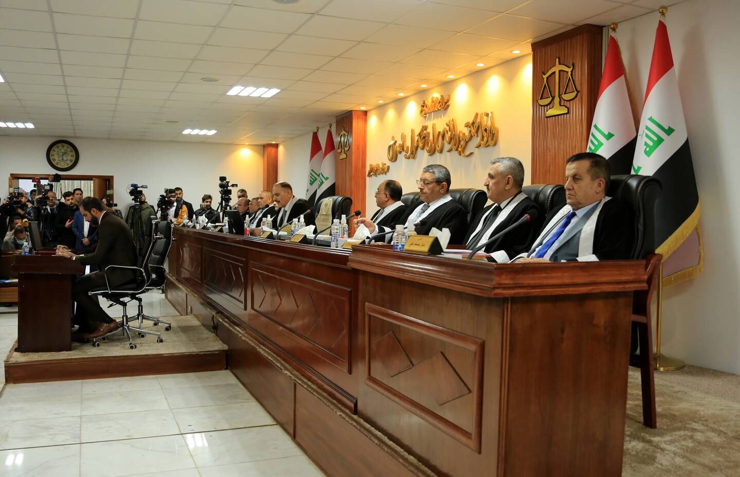 Judge Jassim Mohammed Aboud (Centre) head of the Iraqi Federal Supreme Court and other judges attend a session in Baghdad, December 27. EPA
