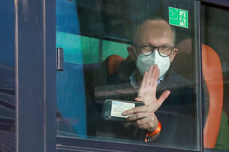 Peter Ben Embarek, a member of the WHO team tasked with investigating the origins of the Covid-19 pandemic, waves from a bus while leaving Wuhan Tianhe International Airport in Wuhan, Hubei province, China. Reuters