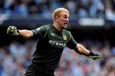 MANCHESTER, ENGLAND - MAY 13:  Goalkeeper Joe Hart of Manchester City celebrates winning the title as the final whistle blows during the Barclays Premier League match between Manchester City and Queens Park Rangers at the Etihad Stadium on May 13, 2012 in Manchester, England.  (Photo by Shaun Botterill/Getty Images)