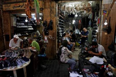 Among meandering alleyways in the historic market of Lebanon's southern city of Sidon, cobblers and menders are doing brisk business, as an economic crisis revives demand for once fading trades. All photos: AFP