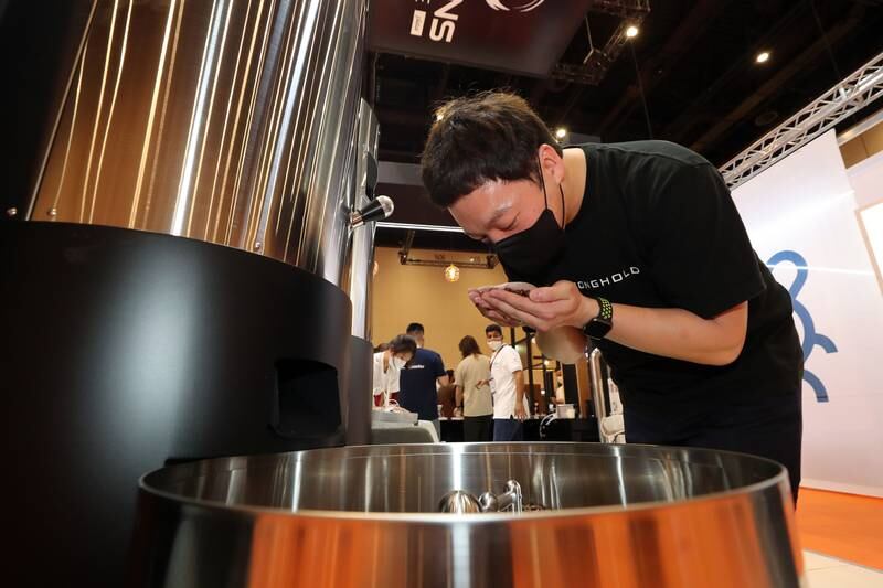Yphan Lee checks coffee beans after being in a roaster.