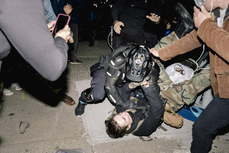 A New York City Police Department officer clashes with a demonstrator at a protest during the 2020 Presidential election in New York. Bloomberg