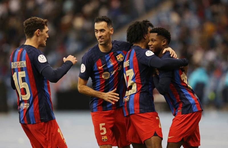 Barcelona's Ansu Fati celebrates scoring their second goal with teammates. Reuters