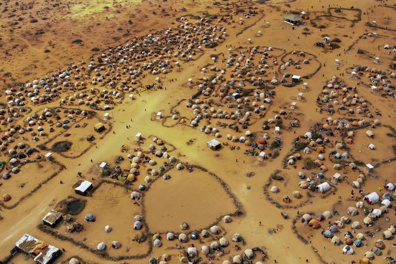 Huts made of branches and cloth provide shelter to people displaced by drought on the outskirts of Dollow, Somalia. AP
