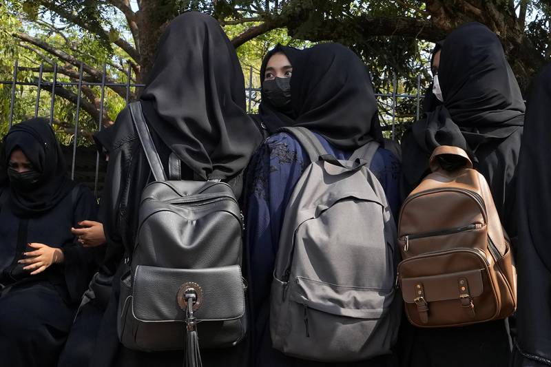 Indian Muslim students wearing hijabs prepare to leave after they were denied entry into the campus of Mahatma Gandhi Memorial college in Udupi, Karnataka state, India in February. AP